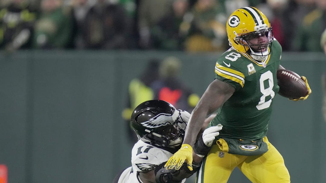 Green Bay Packers running back Josh Jacobs (8) makes a reception for a first down before ebbing tackled by Philadelphia Eagles linebacker Nakobe Dean (17) during the first quarter of their game Monday, November 10, 2025 at Lambeau Field in Green Bay, Wisconsin.