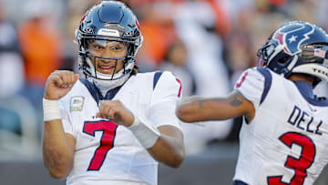 Nov 12, 2023; Cincinnati, Ohio, USA; Houston Texans quarterback C.J. Stroud (7) reacts after scoring a touchdown with wide receiver Tank Dell (3) in the second half against the Cincinnati Bengals at Paycor Stadium. Mandatory Credit: Katie Stratman-Imagn Images