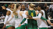 The Oregon volleyball team celebrates a point over Illinois in their first Big Ten matchup of the season.