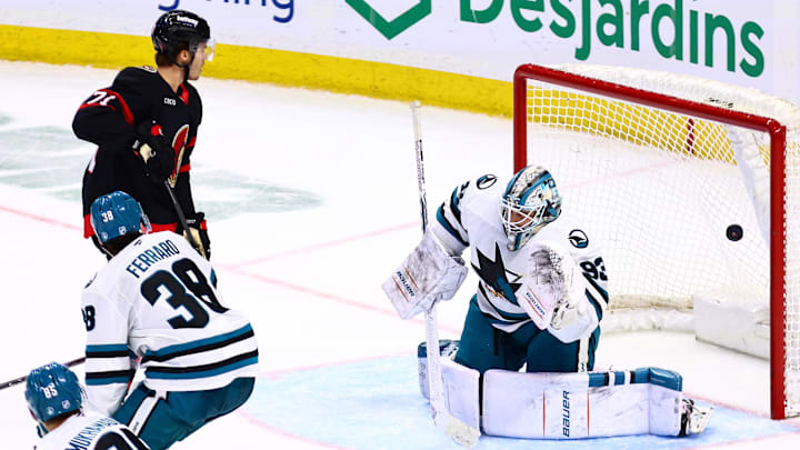 Mar 15, 2026; Ottawa, Ontario, CAN; Ottawa Senators center Ridly Greig (71) watches as a shot by center Dylan Cozens (not pictured) goes past San Jose Sharks goaltender Laurent Broissoit (93) during the third period at Canadian Tire Centre. Mandatory Credit: Keito Newman-Imagn Images


