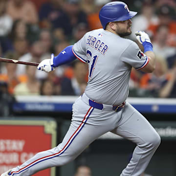 Jul 11, 2025; Houston, Texas, USA; Texas Rangers first baseman Jake Burger (21) bats during the game against the Houston Astros at Daikin Park. 