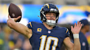Oct 23, 2025; Inglewood, California, USA; Los Angeles Chargers quarterback Justin Herbert (10) practices before the game against the Minnesota Vikings at SoFi Stadium. Mandatory Credit: Jayne Kamin-Oncea-Imagn Images
