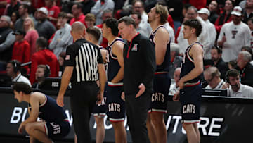 Jan 18, 2025; Lubbock, Texas, USA;  Arizona Wildcats head coach Tommy Lloyd questions Big 12 official Michael Greenstein at the end of the game against the Texas Tech Red Raiders at United Supermarkets Arena. Mandatory Credit: Michael C. Johnson-Imagn Images