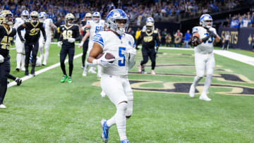 Dec 3, 2023; New Orleans, Louisiana, USA; Detroit Lions running back David Montgomery (5) runs in for a touchdown against New Orleans Saints linebacker Nephi Sewell (45) during the first half at Caesars Superdome. Mandatory Credit: Stephen Lew-USA TODAY Sports