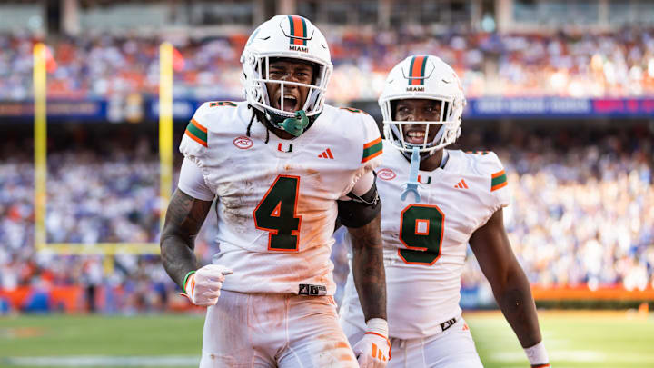 Aug 31, 2024; Gainesville, Florida, USA; Miami Hurricanes running back Mark Fletcher Jr. (4) and Miami Hurricanes tight end Elija Lofton (9) celebrate after a touchdown against the Florida Gators during the second half at Ben Hill Griffin Stadium. Mandatory Credit: Matt Pendleton-Imagn Images