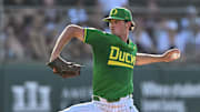 Jun 9, 2024; College Station, TX, USA; Oregon pitcher Grayson Grinsell (2) throws a pitch during the first inning against Texas A&M at Olsen Field, Blue Bell Park Mandatory Credit: Maria Lysaker-Imagn Images