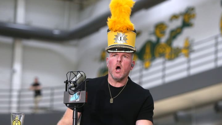 Pat McAfee dons an Iowa marching band hat while hosting his ESPN show Friday, March 22, 2024 from the Field House in Iowa City, Iowa.