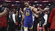 Golden State Warriors guard Stephen Curry walks off the court after the game against the Houston Rockets.