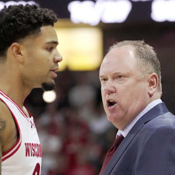 Wisconsin head coach Greg Gard talks with guard Nick Boyd (2) during the first half of their game against Campbell Monday, November 3, 2025 at the Kohl Center in Madison, Wisconsin.