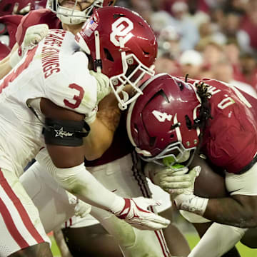 Nov 15, 2025; Tuscaloosa, Alabama, USA;  Alabama Crimson Tide running back Daniel Hill (4) runs into the end zone for a touchdown as Oklahoma Sooners defensive back Robert Spears-Jennings (3) closes in at Saban Field at Bryant-Denny Stadium. Oklahoma defeated Alabama 23-21. Mandatory Credit: Gary Cosby Jr.-Imagn Images