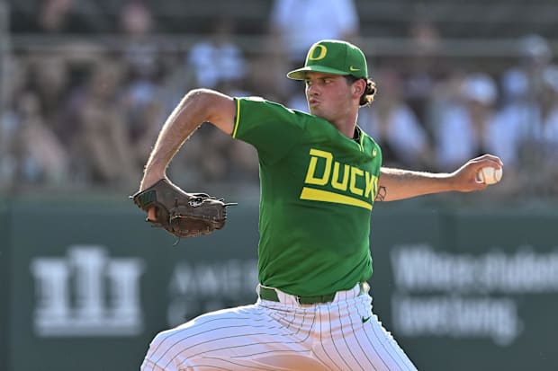 Oregon Pitcher Grayson Grinsell (2) throws a field during the first inn against Texas A&M in Olsen Field