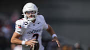 Sep 6, 2025; Cincinnati, Ohio, USA; Cincinnati Bearcats quarterback Brendan Sorsby (2) runs with the ball as he looks to pass against the Bowling Green Falcons in the first half at Nippert Stadium. Mandatory Credit: Aaron Doster-Imagn Images