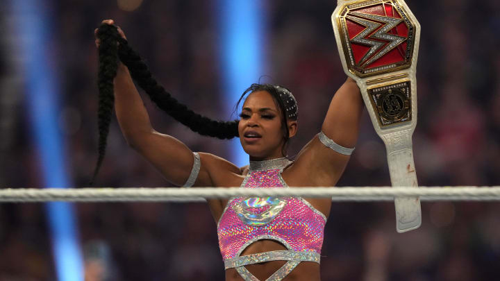 Jan 28, 2023; San Antonio, TX, USA; Bianca Belair celebrates after defeating Alexa Bliss (not pictured) in their Raw Women   s Championship match at the WWE Royal Rumble at the Alamodome. Mandatory Credit: Joe Camporeale-USA TODAY Sports