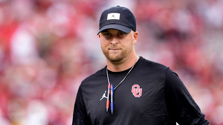 Oklahoma Offensive Coordinator / Quarterbacks coach Ben Arbuckle watches warm up before the college football game between the University of Oklahoma Sooners and the Illinois State Redbirds at the Gaylord Family Ð Oklahoma Memorial Stadium in Norman, Okla., Saturday, Aug. 30, 2025.