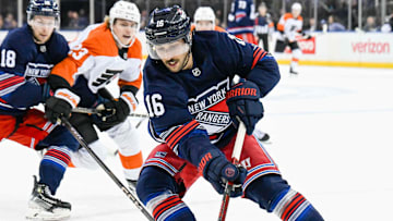 Apr 9, 2025; New York, New York, USA;  New York Rangers center Vincent Trocheck (16) plays the loose puck against the Philadelphia Flyers during the first period at Madison Square Garden. Mandatory Credit: Dennis Schneidler-Imagn Images