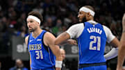 Mar 31, 2025; Dallas, Texas, USA; Dallas Mavericks guard Klay Thompson (31) and center Daniel Gafford (21) celebrate during the second quarter against the Brooklyn Nets at the American Airlines Center. Mandatory Credit: Jerome Miron-Imagn Images