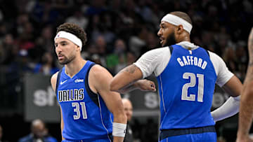 Mar 31, 2025; Dallas, Texas, USA; Dallas Mavericks guard Klay Thompson (31) and center Daniel Gafford (21) celebrate during the second quarter against the Brooklyn Nets at the American Airlines Center. Mandatory Credit: Jerome Miron-Imagn Images