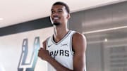 Sep 29, 2025; San Antonio, TX, USA; San Antonio Spurs forward-center Victor Wembanyama (1) enters the court before posing for photos and taking questions during Media Day at Victory Capital Performance Center in San Antonio.