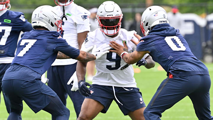 New England Patriots wide receiver Kayshon Boutte (9) works with cornerback Carlton Davis III (7) and cornerback Christian Gonzalez (0) during minicamp at Gillette Stadium. Mandatory Credit: Eric Canha-Imagn Images