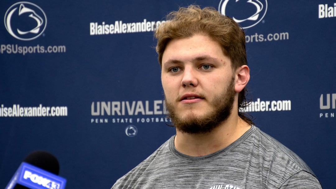 Penn State offensive lineman answers questions during a post-practice media session at Holuba Hall in State College.