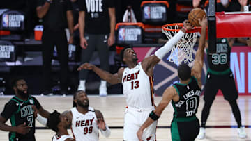 Sep 15, 2020; Lake Buena Vista, Florida, USA; Miami Heat forward Bam Adebayo (13) blocks a shot by Boston Celtics forward Jayson Tatum (0) during overtime in game one of the Eastern Conference Finals of the 2020 NBA Playoffs at ESPN Wide World of Sports Complex. Mandatory Credit: Kim Klement-Imagn Images
