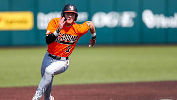Oklahoma State utility man Carson Benge (3) rounds second base during the Bedlam baseball game against the Oklahoma Sooners at L. Dale Mitchell Park in Norman, OK.