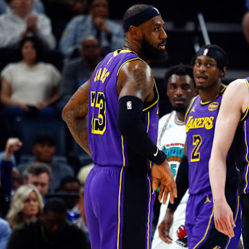 Mar 29, 2025; Memphis, Tennessee, USA; Los Angeles Lakers forward LeBron James (23) and  guard Dalton Knecht (4) react during the second quarter against the Memphis Grizzlies at FedExForum. Mandatory Credit: Petre Thomas-Imagn Images