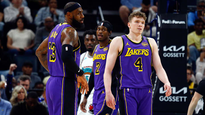 Mar 29, 2025; Memphis, Tennessee, USA; Los Angeles Lakers forward LeBron James (23) and guard Dalton Knecht (4) react during the second quarter against the Memphis Grizzlies at FedExForum. Mandatory Credit: Petre Thomas-Imagn Images