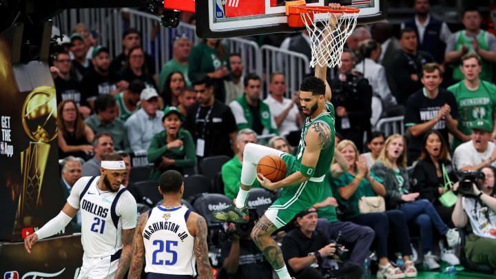 Jun 17, 2024; Boston, Massachusetts, USA; Boston Celtics forward Jayson Tatum (0) dunks the ball against Dallas Mavericks center Daniel Gafford (21) in game five of the 2024 NBA Finals at TD Garden. Mandatory Credit: Peter Casey-USA TODAY Sports