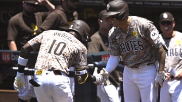 San Diego Padres left fielder Jurickson Profar (10) is congratulated by designated hitter Manny Machado.