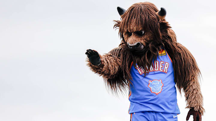 Rumble the Bison waves to children during the Saint Patrick's Day Parade at the Stockyards in Oklahoma City, on Saturday, March 16, 2024.