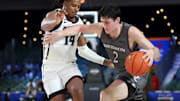 Nov 28, 2024;  Paradise Island, Bahamas, BHS; Davidson Wildcats forward Bobby Durkin (2) drives to the basket as Providence Friars guard Corey Floyd Jr. (14) defends during the second half at the Imperial Arena at the Atlantis Resort.  Mandatory Credit: Kevin Jairaj-Imagn Images