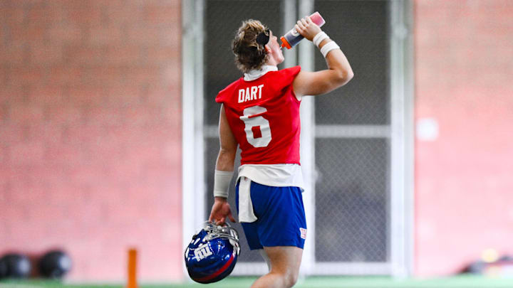 Jun 18, 2025; East Rutherford, NJ, USA; New York Giants quarterback Jaxson Dart (6) hydrates during minicamp at Quest Diagnostics Training Center. Mandatory Credit: John Jones-Imagn Images