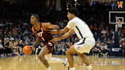Feb 1, 2025; Charlottesville, Virginia, USA; Virginia Tech Hokies forward Tobi Lawal (1) dribbles the ball as Virginia Cavaliers forward Jacob Cofie (5) defends at John Paul Jones Arena. Mandatory Credit: Emily Morgan-Imagn Images