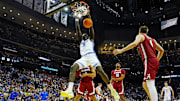 Mar 29, 2025; Newark, NJ, USA; Duke Blue Devils guard Sion James (14) dunks the ball against Alabama Crimson Tide forward Mouhamed Dioubate (10) during the second half in the East Regional final of the 2025 NCAA tournament at Prudential Center. Mandatory Credit: Robert Deutsch-Imagn Images