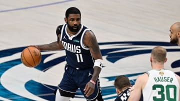 Jun 14, 2024; Dallas, Texas, USA; Dallas Mavericks guard Kyrie Irving (11) dribbles against the Boston Celtics during the second half of game four of the 2024 NBA Finals at American Airlines Center. Mandatory Credit: Jerome Miron-USA TODAY Sports