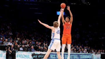 Mar 11, 2022; Brooklyn, NY, USA; Virginia Tech Hokies forward Keve Aluma (22) shoots a three point shot against North Carolina Tar Heels forward Brady Manek (45) during the second half of an ACC Tournament semifinal game at Barclays Center. Mandatory Credit: Brad Penner-USA TODAY Sports