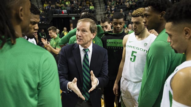 Oregon Ducks head coach Dana Altman instructs his players before a game against the Alabama State Hornets