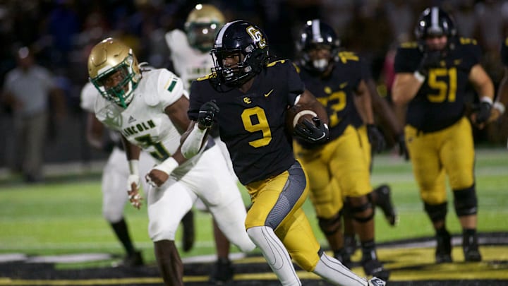 Colquitt County junior running back Chad White, Jr. (9) rushed the ball downfield in a game against Lincoln on Sept. 28, 2022, at Mack Tharpe Stadium. The Packers won 30-7. Colquitt County junior running back Chad White, Jr. (9) rushed the ball downfield in a game against Lincoln on Sept. 28, 2022, at Mack Tharpe Stadium. The Packers won 30-7.
