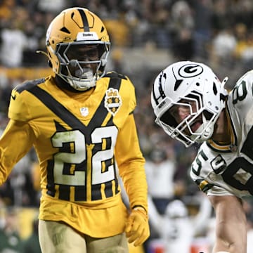 Oct 26, 2025; Pittsburgh, Pennsylvania, USA; Green Bay Packers tight end Tucker Kraft (85) scores a touchdown against Pittsburgh Steelers safety Chuck Clark (21) and safety Juan Thornhill (22)during the fourth quarter at Acrisure Stadium. Mandatory Credit: Barry Reeger-Imagn Images