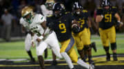 Colquitt County junior running back Chad White, Jr. (9) rushed the ball downfield in a game against Lincoln on Sept. 28, 2022, at Mack Tharpe Stadium. The Packers won 30-7.

J9t3919