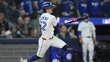 Nov 1, 2025; Toronto, Ontario, CAN; Toronto Blue Jays third baseman Ernie Clement (22) hits a double against the Los Angeles Dodgers in the eighth inning during game seven of the 2025 MLB World Series at Rogers Centre. Mandatory Credit: John E. Sokolowski-Imagn Images