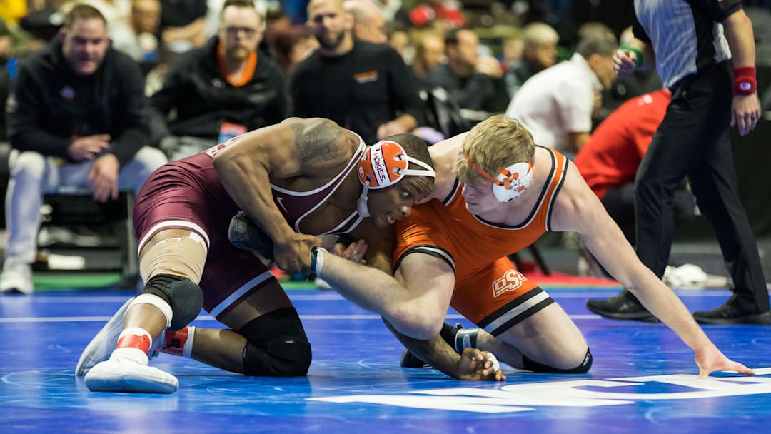 Virginia Tech wrestler Mekhi Lewis wrestles Oklahoma State wrestler Dustin Plott in a 174 pound weight class consolation semifinal during the 2023 NCAA Wrestling Championships at the BOK Center. Mandatory Credit: Brett Rojo-Imagn Images