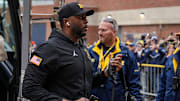 Michigan head coach Sherrone Moore walks off the bus as the team arrive at Michigan Stadium in Ann Arbor ahead of Purdue game on Saturday, November 1, 2025.