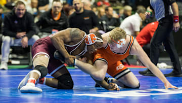 Virginia Tech wrestler Mekhi Lewis wrestles Oklahoma State wrestler Dustin Plott in a 174 pound weight class consolation semifinal during the 2023 NCAA Wrestling Championships at the BOK Center. Mandatory Credit: Brett Rojo-Imagn Images
