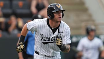 Vanderbilt infielder Braden Holcomb (26) runs to first base during a NCAA baseball game between the Tennessee Volunteers and Vanderbilt Commodores at Lindsey Nelson Stadium on May 11, 2025.