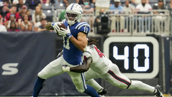 Sep 17, 2023; Houston, Texas, USA; Houston Texans cornerback Tavierre Thomas (4) works to bring down Indianapolis Colts wide receiver Michael Pittman Jr. (11) at NRG Stadium. Mandatory Credit: Jenna Watson-Imagn Images