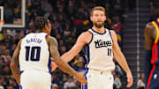 Jan 5, 2025; San Francisco, California, USA; Sacramento Kings center Domantas Sabonis (11) high fives forward/guard DeMar DeRozan (10) after scoring a basket against the Golden State Warriors during the second quarter at Chase Center. Mandatory Credit: Kelley L Cox-Imagn Images