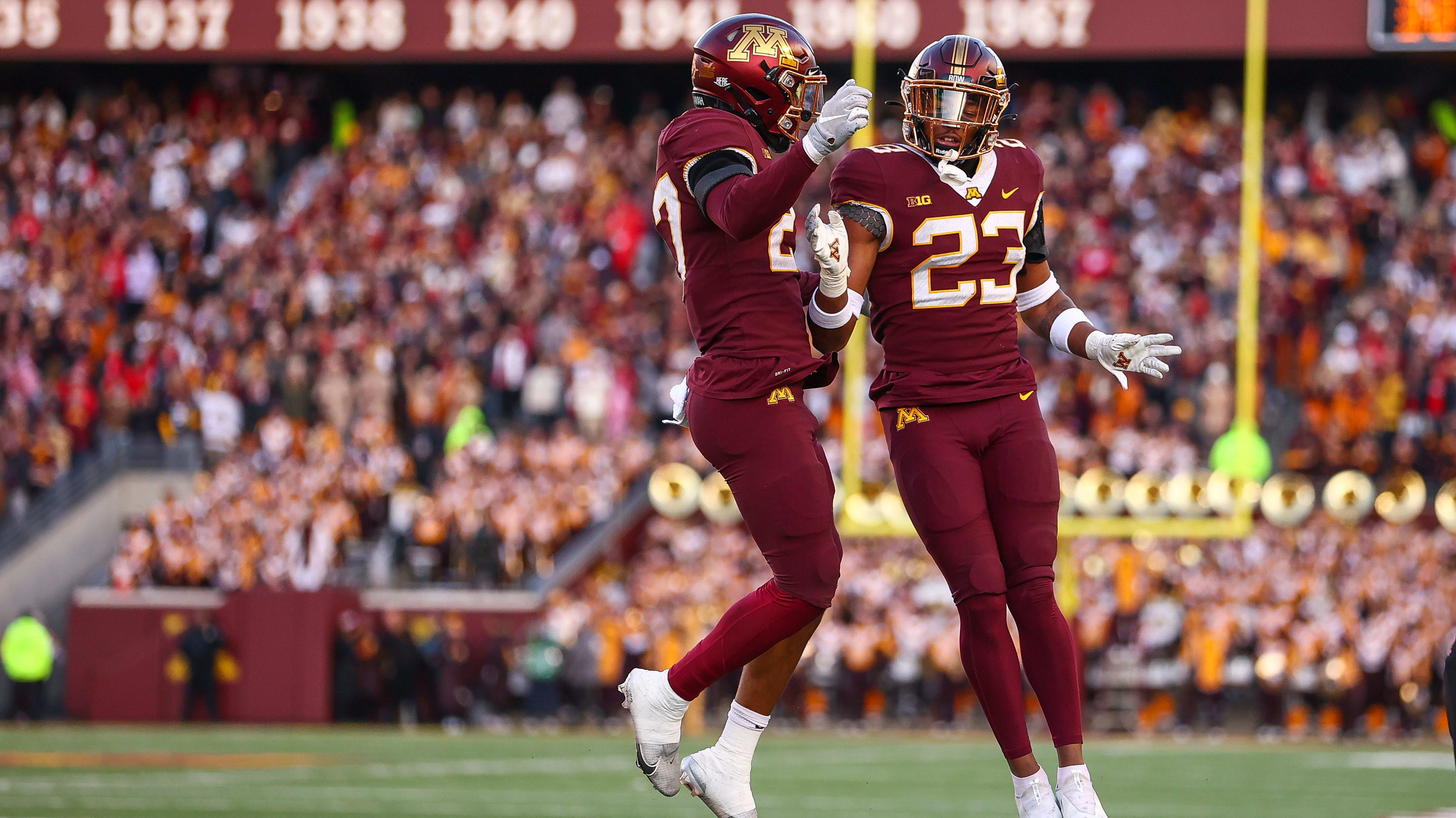 Minnesota Gophers defensive backs Tyler Nubin  and Jordan Howden celebrate.