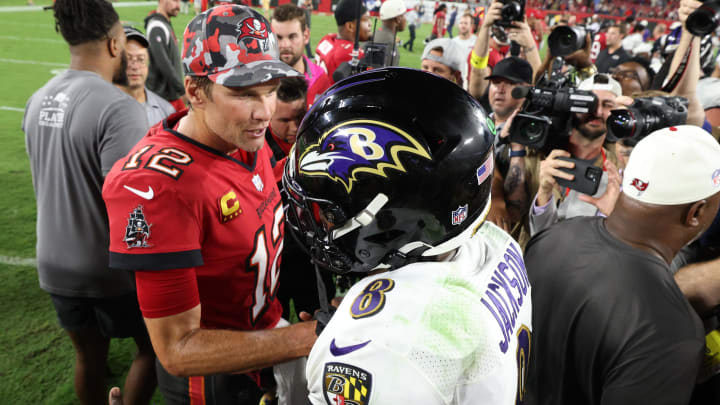 Tampa Bay Buccaneers quarterback Tom Brady (12) greets Baltimore Ravens quarterback Lamar Jackson (8) after a game at Raymond James Stadium.